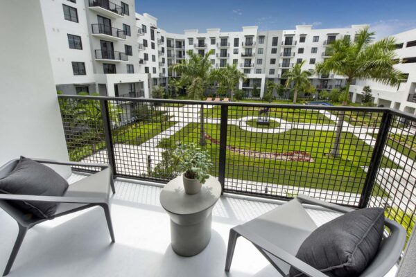 Apartment balcony overlooking courtyard.