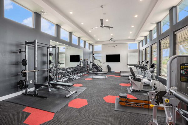 Fitness center with cardio machines and weight lifting equipment.