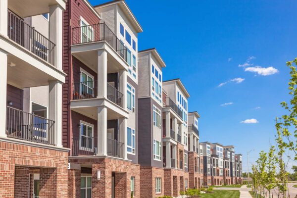 Summit Square apartments with modern construction and lush landscaping.