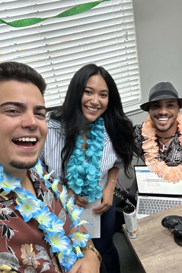 Avanti employees smiling and posing together.