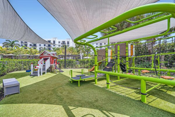 Sanctuary Doral apartments playground with equipment and sun shade sails.