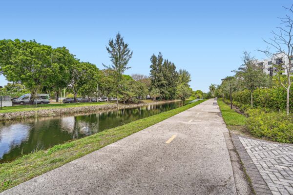Sanctuary Doral apartments with nearby canal waterway and walking paths.