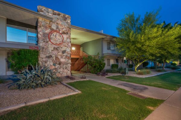 Aura at Midtown apartments with classic mid century architecture and lush landscaping.
