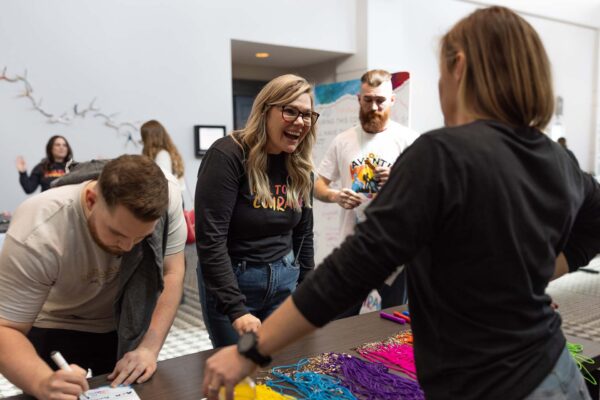 Avanti employees working together at event.