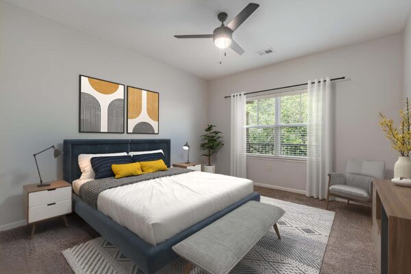 Highlands Lodge apartment bedroom with carpet, plush bed with headboard, ceiling fan, and large window.