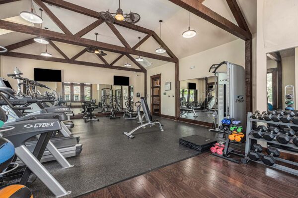 Highlands Lodge apartments fitness center with cardio machines and weight equipment.