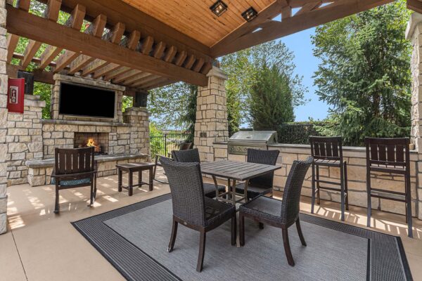 Highlands Lodge outdoor gazebo with fireplace, TV, and built in BBQ grill.