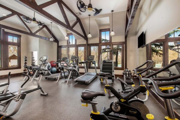 Highlands Lodge apartments fitness center with cardio machines and weight equipment.