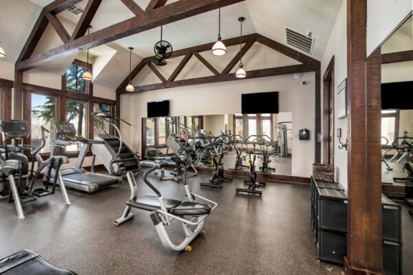 Highlands Lodge apartments fitness center with cardio machines and weight equipment.