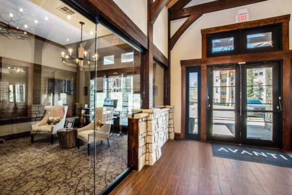 Highlands Lodge apartments lobby with rustic wood architecture and leasing office.