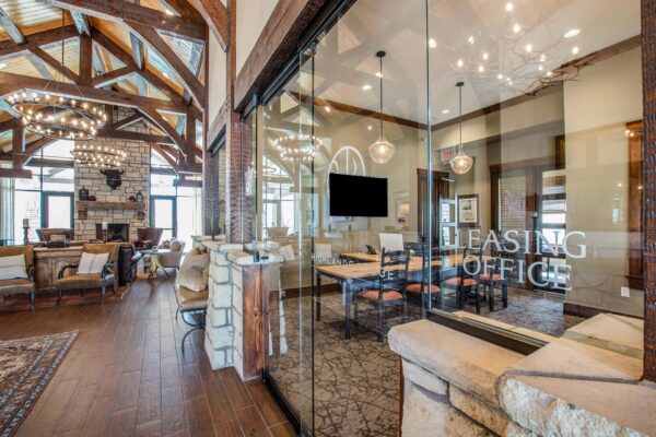Highlands Lodge apartments lobby with rustic vaulted ceilings and leasing office.