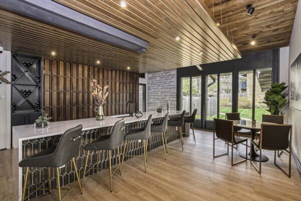 Kenilworth apartments clubhouse with elegant bar, dining table, and wine storage.