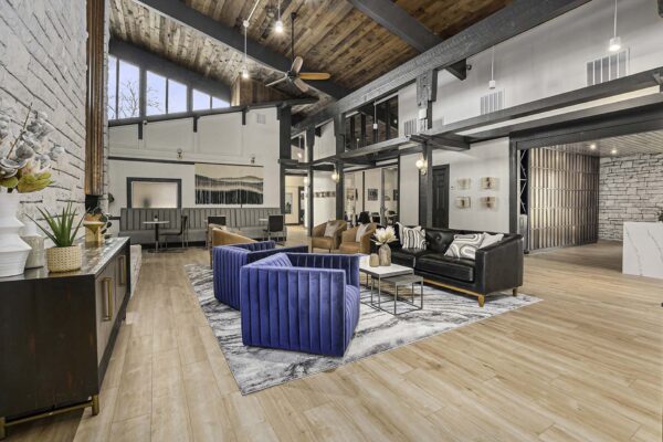 Kenilworth apartments clubhouse with plush seating, vaulted ceilings, and large windows.
