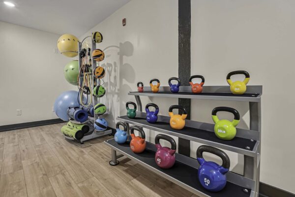 Kenilworth apartments fitness center with calisthenics equipment.