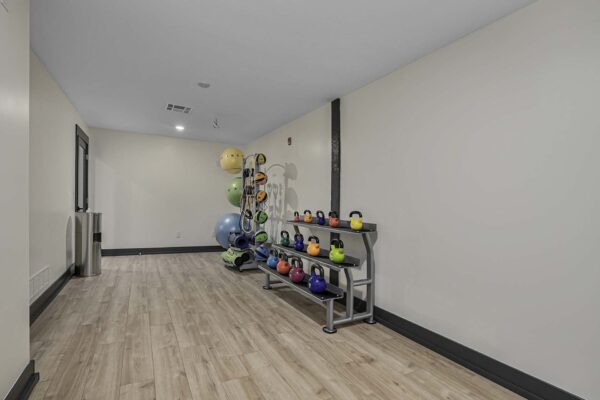 Kenilworth apartments fitness center with calisthenics equipment.