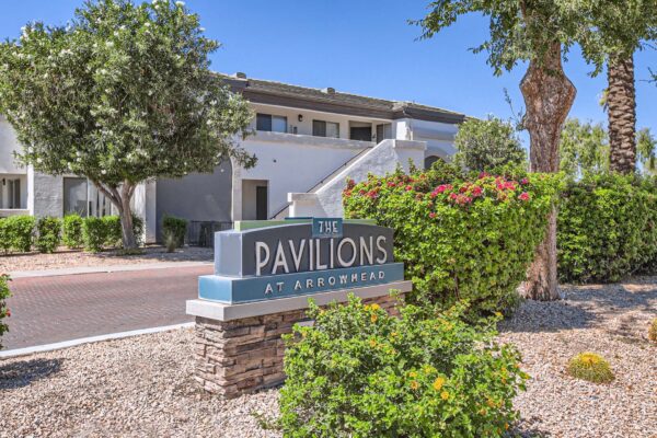 Pavilions at Arrowhead apartments with lush rocky landscaping.