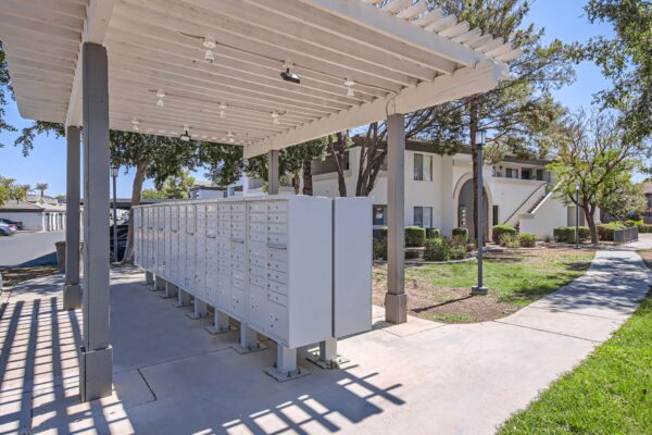 Pavilions at Arrowhead apartments mail area with covered mail boxes.