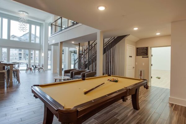 Prairie View at Village West apartments game area with billiards table and racquetball room.