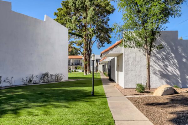 Tempe Vista apartments with classic architecture and lush landscaping.
