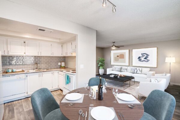 Tempe Vista apartment living area with modern kitchen, comfortable sitting area, and elegant dining space.