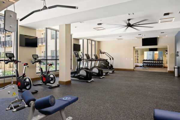 The Locale apartments fitness center with cardio machines and weight equipment.