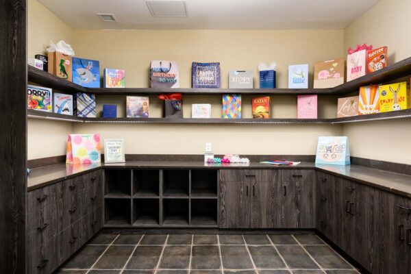 The Locale apartments craft room with gift bags and board games.
