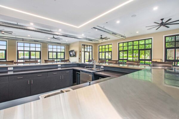 Village at Mission Farms apartments community bar with polish counter top and beer tap.