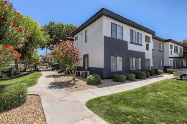 Villas at Mountain Vista Ranch apartments with simple architecture and lush green lawns.
