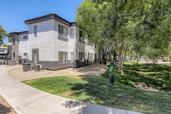 Villas at Mountain Vista Ranch apartments with lush landscaping and tall trees.