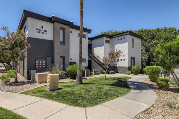 Villas at Mountain Vista Ranch apartments with simple architecture and lush desert landscaping.