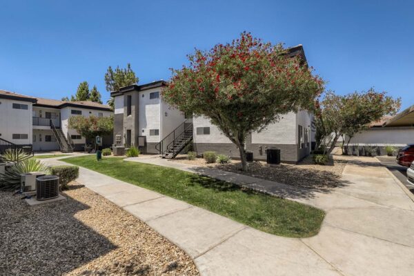 Villas at Mountain Vista Ranch apartments with simple architecture and lush desert landscaping.