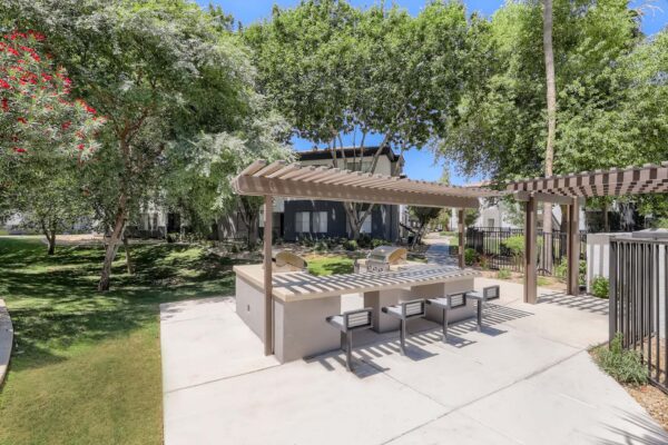 Villas at Mountain Vista Ranch apartments outdoor dining area with built in BBQ grills and gazebo.