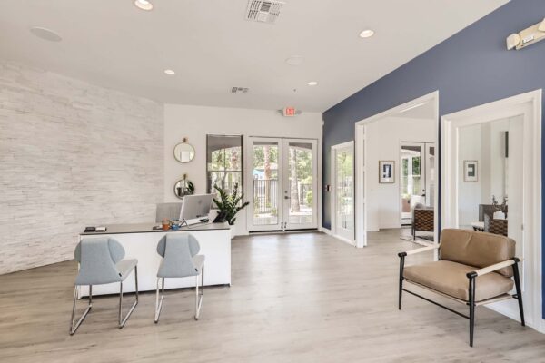 Villas at Mountain Vista Ranch apartments leasing office with leasing desk and comfortable chairs.