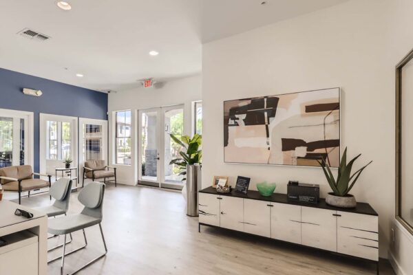 Villas at Mountain Vista Ranch apartments leasing center with office equipment and comfortable chairs.