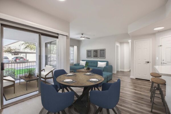 Villas at Mountain Vista Ranch apartment living area with comfortable dining space and large balcony.