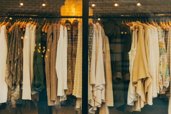Boutique windows filled with designer clothes.