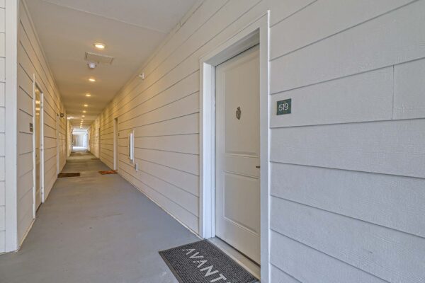 The Avery apartments hallway with apartment entry door.