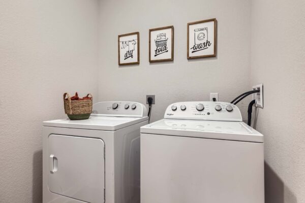 The Avery apartment laundry room with washer and dryer.
