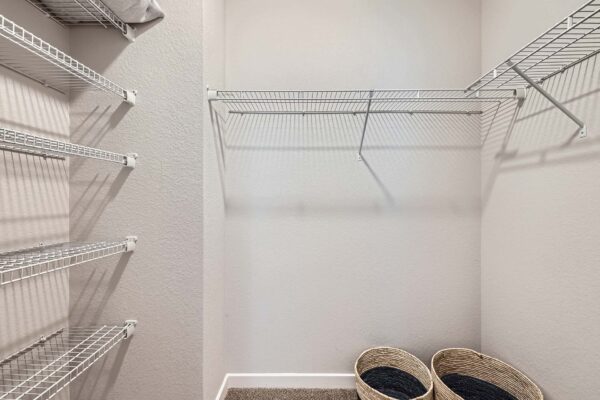 The Avery apartment closet with built in wire shelves.