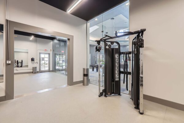 Springs at Alta Mesa apartments fitness center with weight equipment.