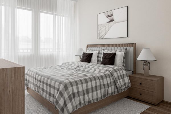 29x apartment bedroom with wood style floor, plush bed with headboard, windows with curtains, and framed artwork.