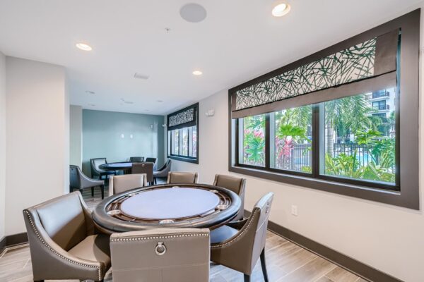 500 Ocean apartments clubhouse with poker tables and large windows.