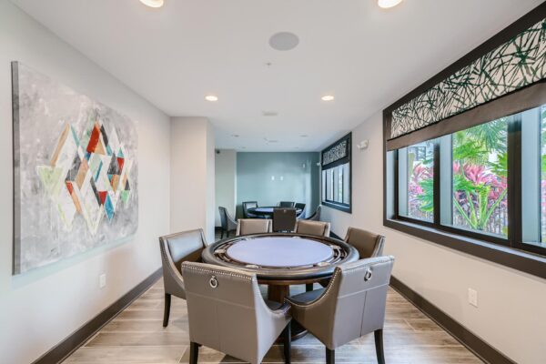 500 Ocean apartments clubhouse with poker tables and large windows.