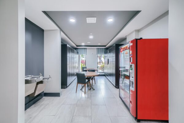 500 Ocean apartments mail room with package lockers and soda machine.