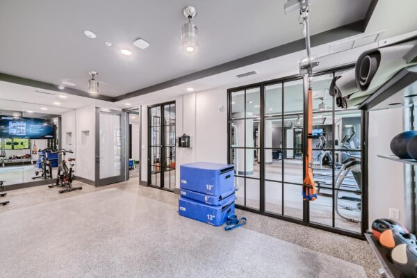 500 Ocean apartments fitness center with cardio machines and weight equipment.