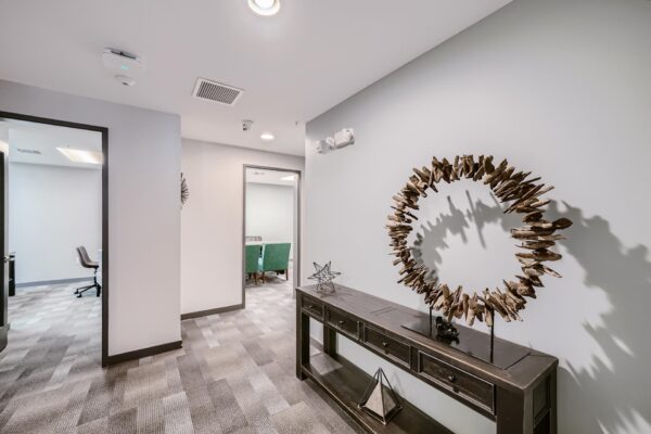 500 Ocean apartments office with pattern carpet and eclectic artwork.