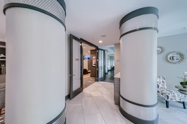 500 Ocean apartments common area with tiled floors and large pillars.