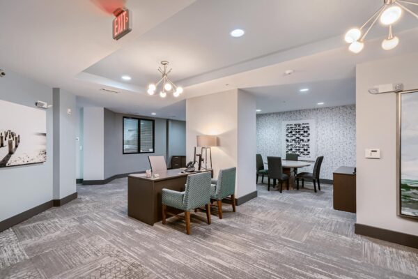 500 Ocean apartments leasing office with desks artwork.