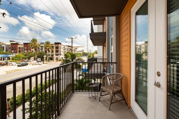 Arte St. Pete apartments balcony with view of palm trees