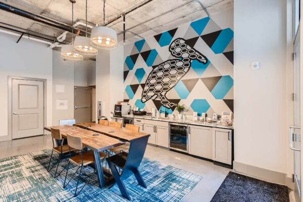 Arte St. Pete apartments coffee bar with large sea bird mural.